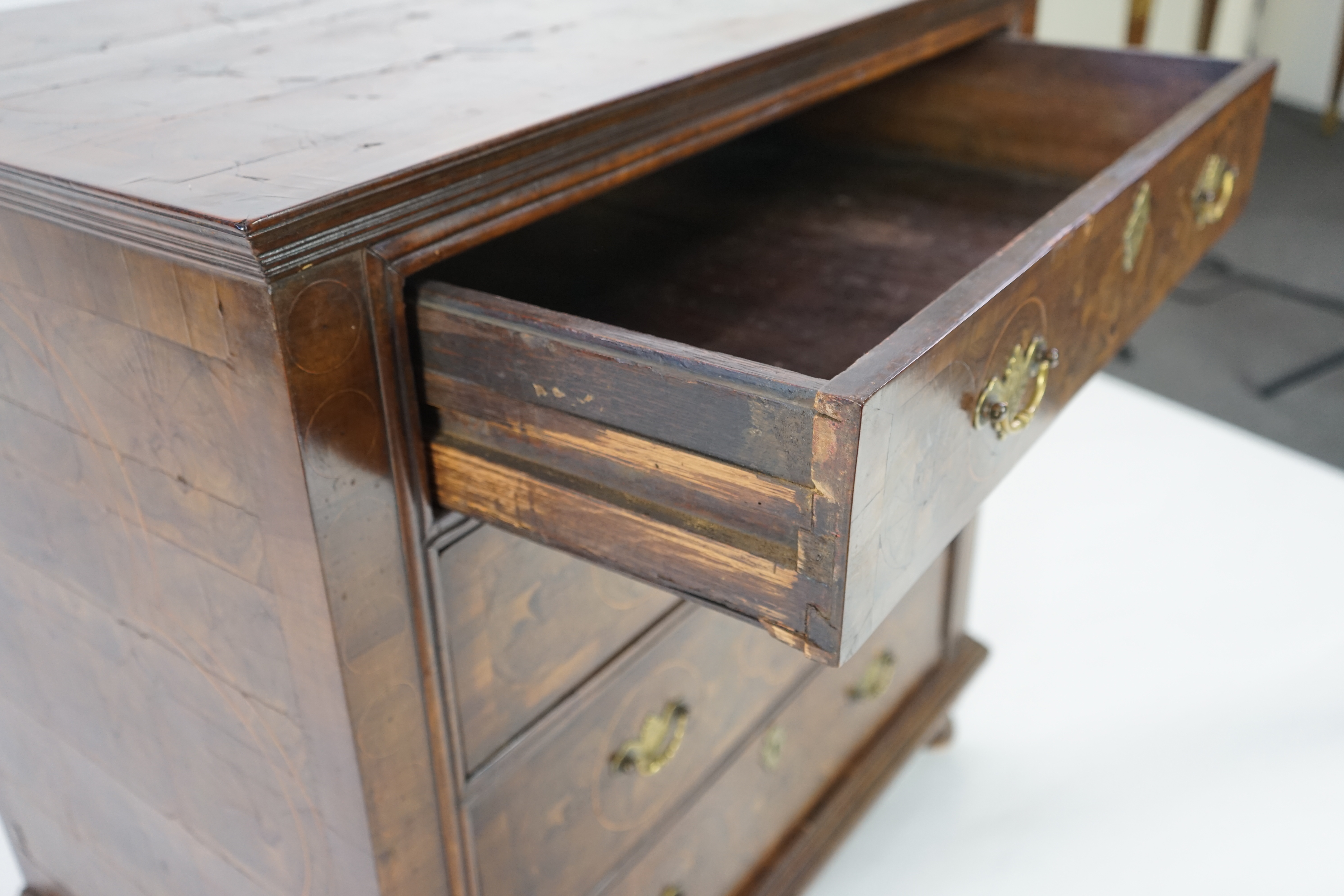 A William and Mary oyster veneered laburnum and walnut chest